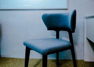 Single upholstered chair in a modern office room.