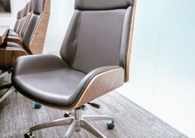 High-back office chair with wheels.