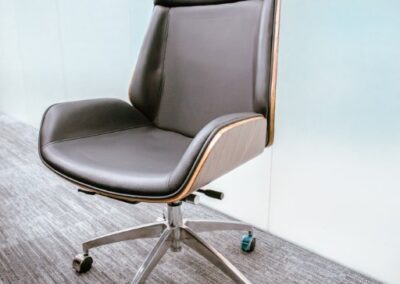 High-back office chair with wheels.